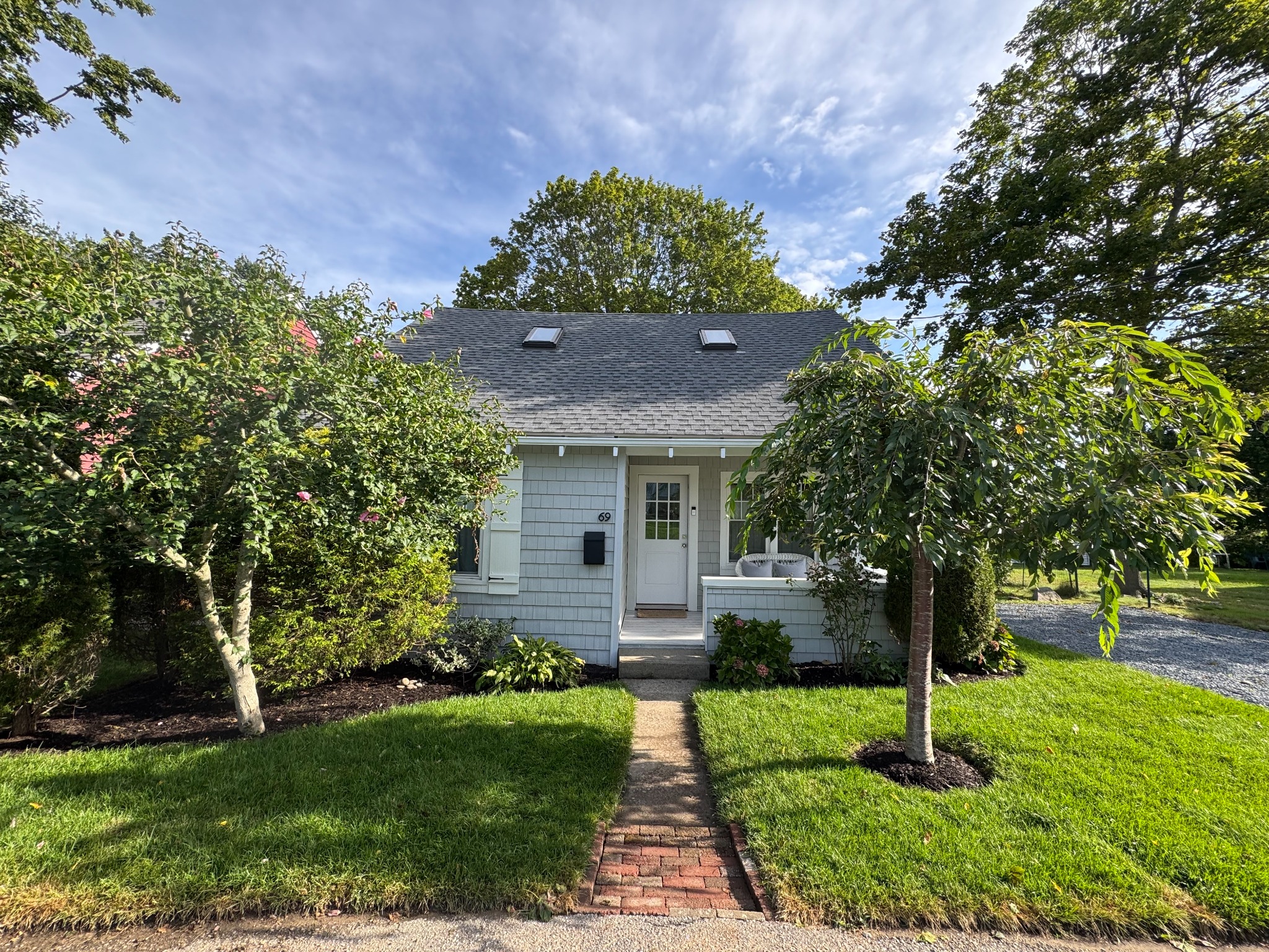 Straight-on view of the cottage and front garden